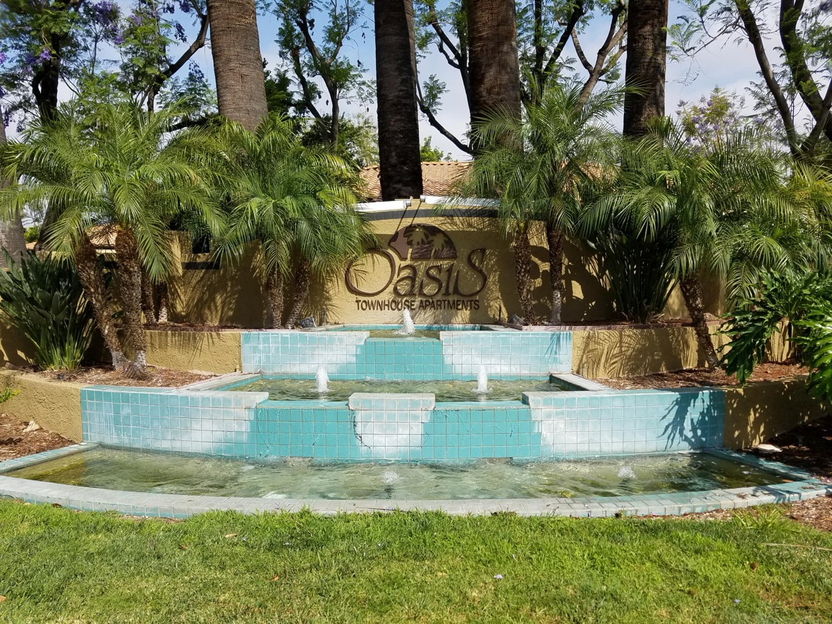 Remodeled water feature with clean aqua tile and clear water, after Speedy Sam's work